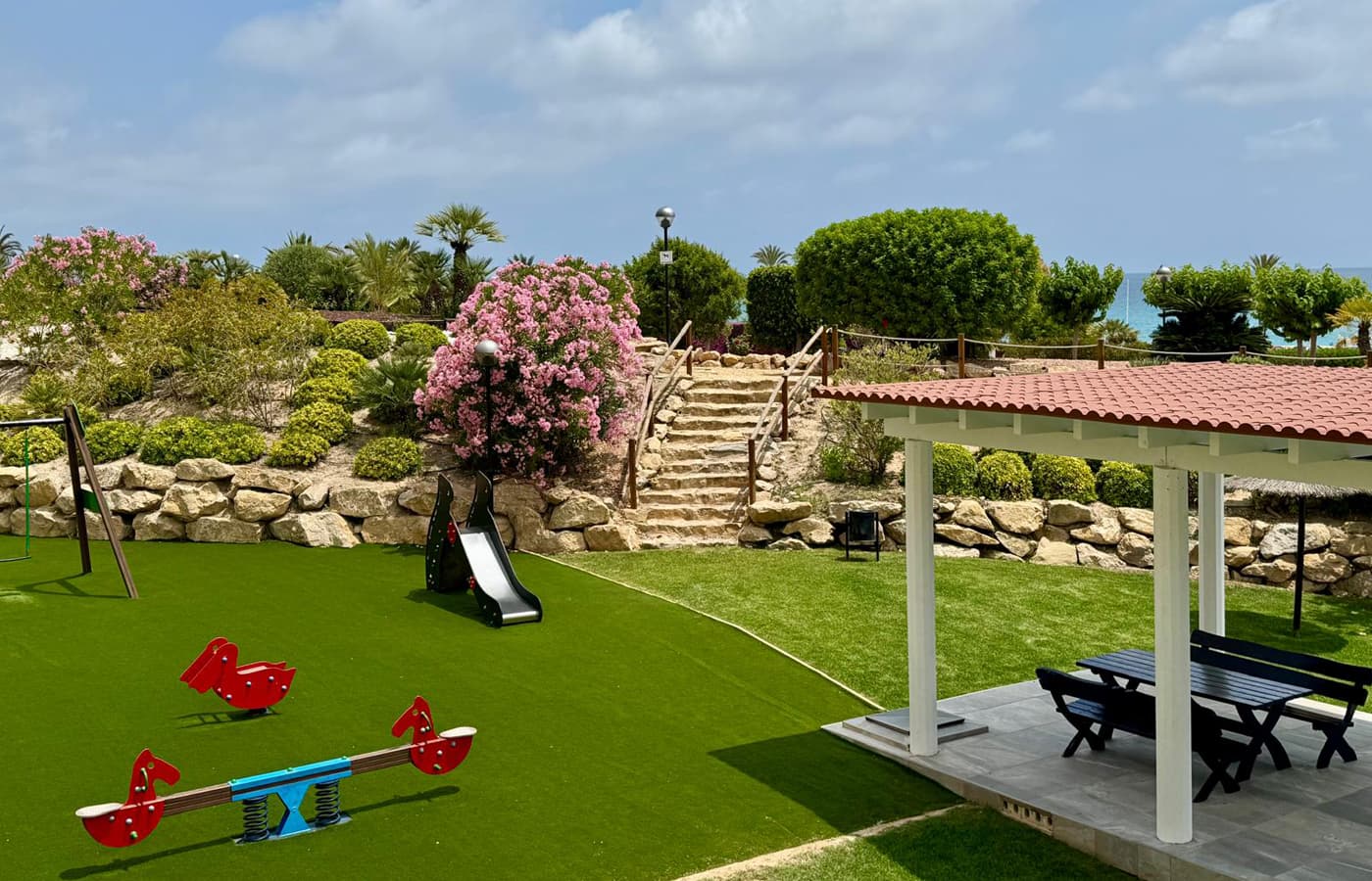 Playground and covered seating area in the residence garden