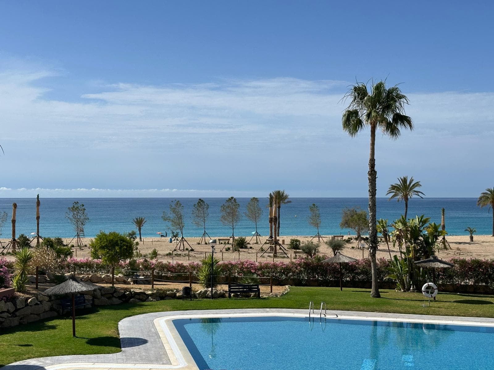 View from the apartment across the garden to the beach