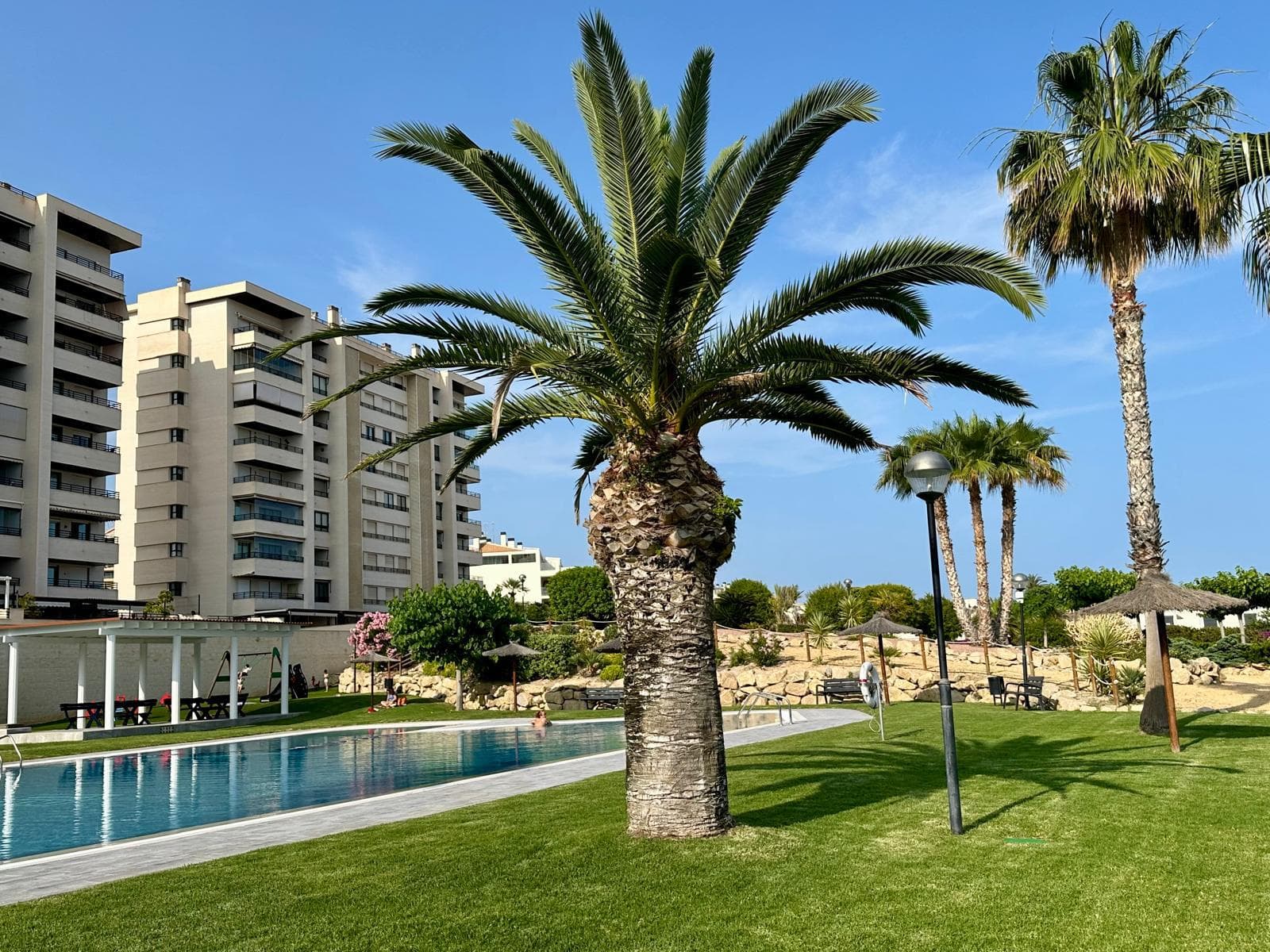 The Paraiso Beach residential buildings with garden and pool